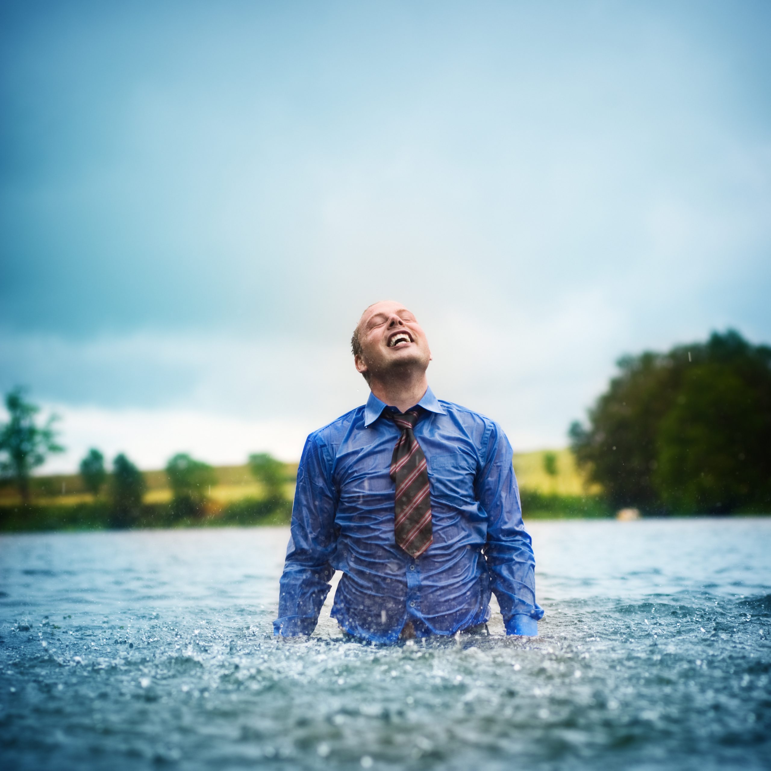 Image of a business man happy after improving sales results.