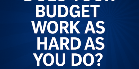 dark blue backdrop with white words in caps "does your budget work as hard as you do"